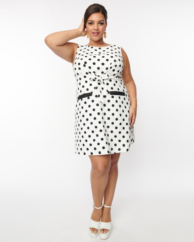 Front of a model wearing a size 2X Smak Parlour White & Black Dots Tie Front Shift Dress in White by Smak Parlour. | dia_product_style_image_id:292657